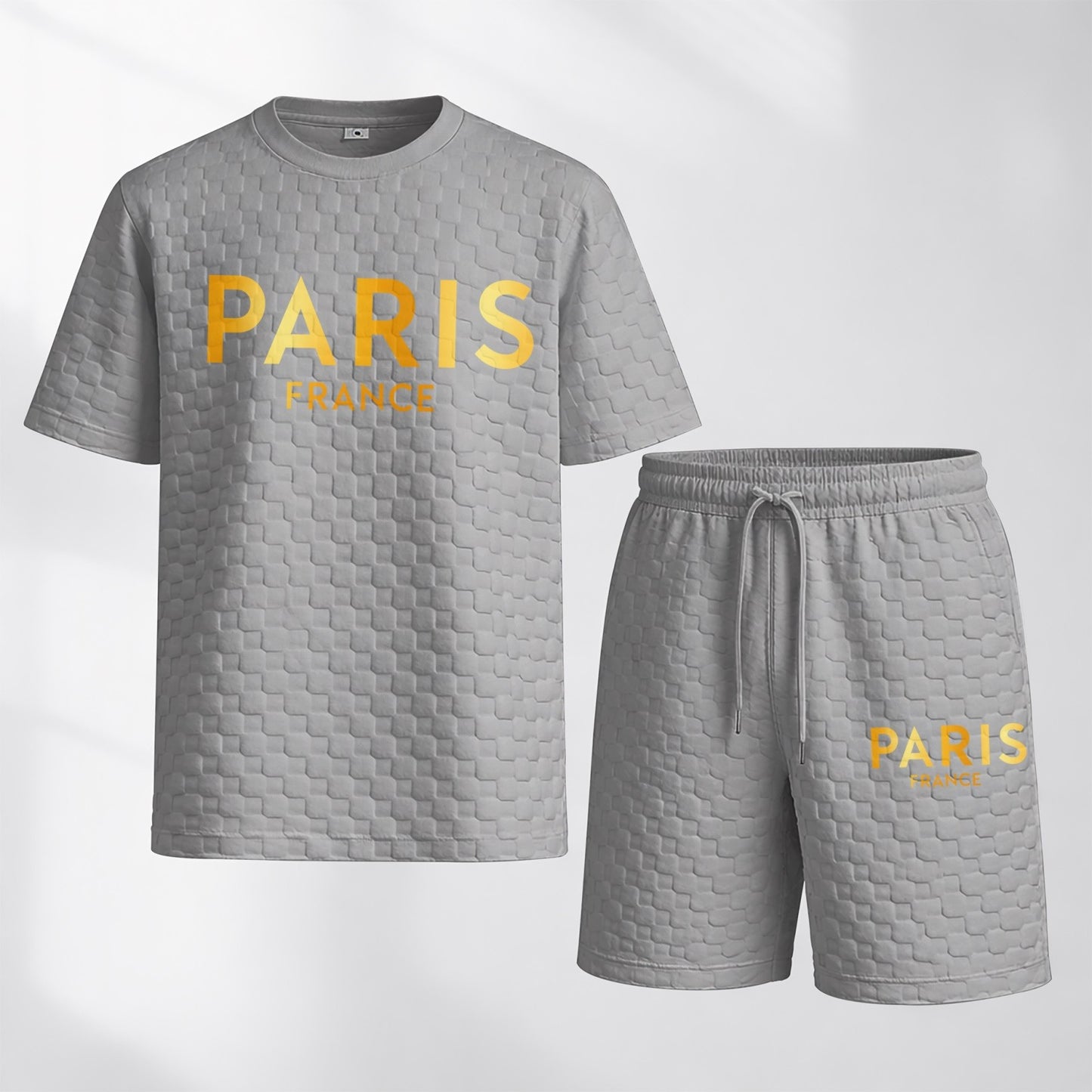 Men's Spring/Summer Drawstring Shorts Set featuring Paris Letter Print and Plaid Fabric—a casual summer ensemble comprising a short-sleeve shirt and shorts, ideal for both everyday wear and athletic activities.