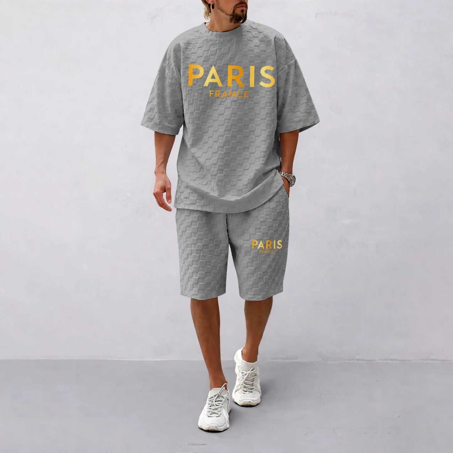 Men's Spring/Summer Drawstring Shorts Set featuring Paris Letter Print and Plaid Fabric—a casual summer ensemble comprising a short-sleeve shirt and shorts, ideal for both everyday wear and athletic activities.